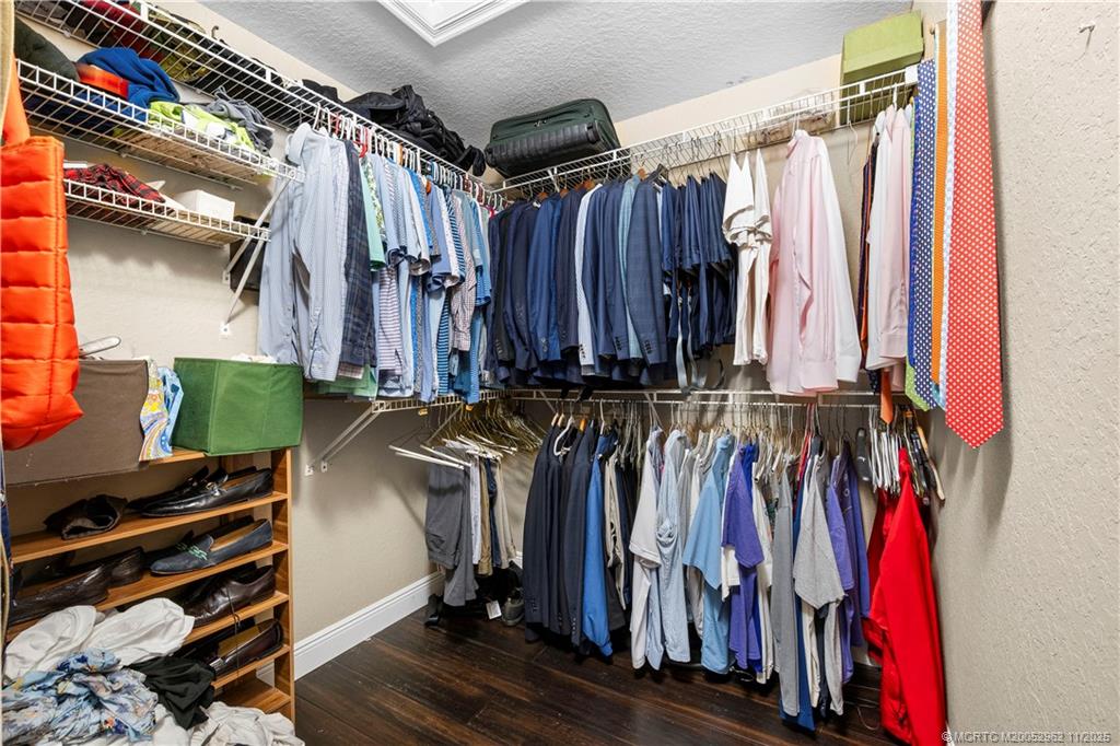 5532 Southeast Graham Drive Stuart, FL 34997 - Photo 18 of 43 a view of walk in closet with clothes
