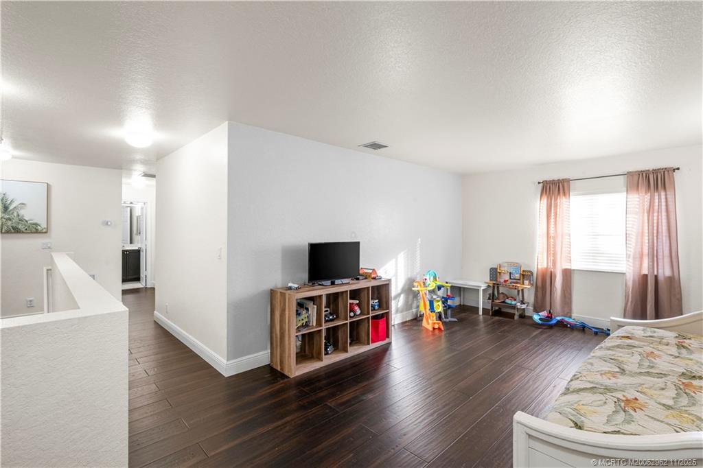 5532 Southeast Graham Drive Stuart, FL 34997 - Photo 23 of 43 a view of a livingroom with furniture and a flat screen tv