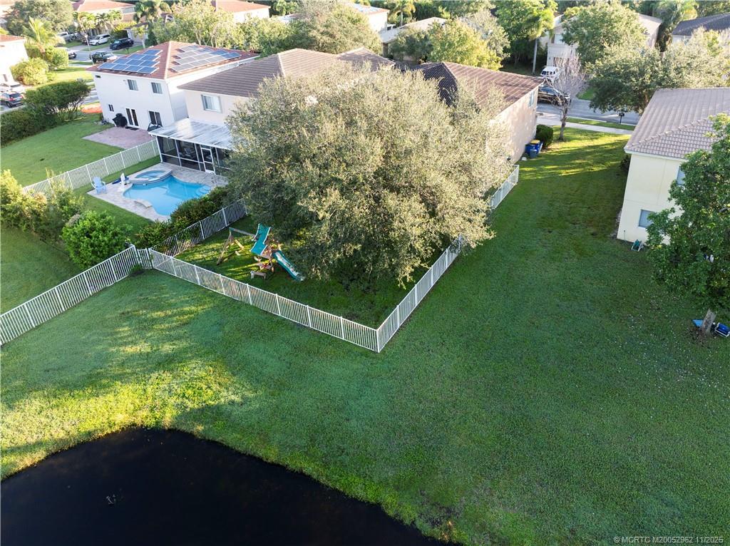 5532 Southeast Graham Drive Stuart, FL 34997 - Photo 31 of 43 an aerial view of residential houses with outdoor space and trees