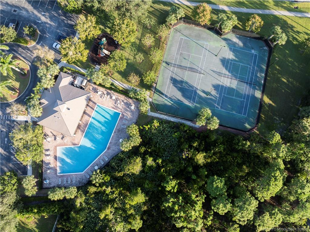 5532 Southeast Graham Drive Stuart, FL 34997 - Photo 35 of 43 a view of a house with a yard and potted plants