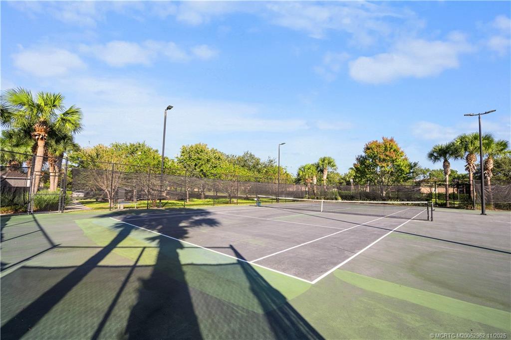 5532 Southeast Graham Drive Stuart, FL 34997 - Photo 40 of 43 a view of an outdoor space and tennis court