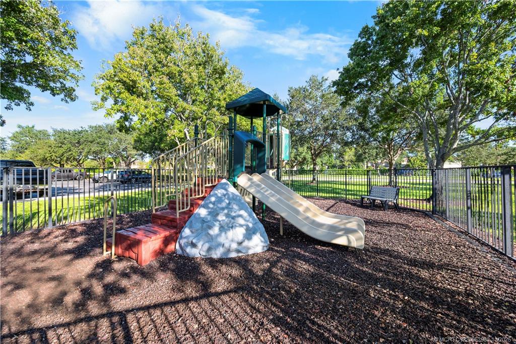 5532 Southeast Graham Drive Stuart, FL 34997 - Photo 43 of 43 a view of a park with large trees and a yard