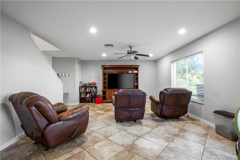 5532 Southeast Graham Drive Stuart, FL 34997 - Photo 7 of 43 a living room with furniture and a window