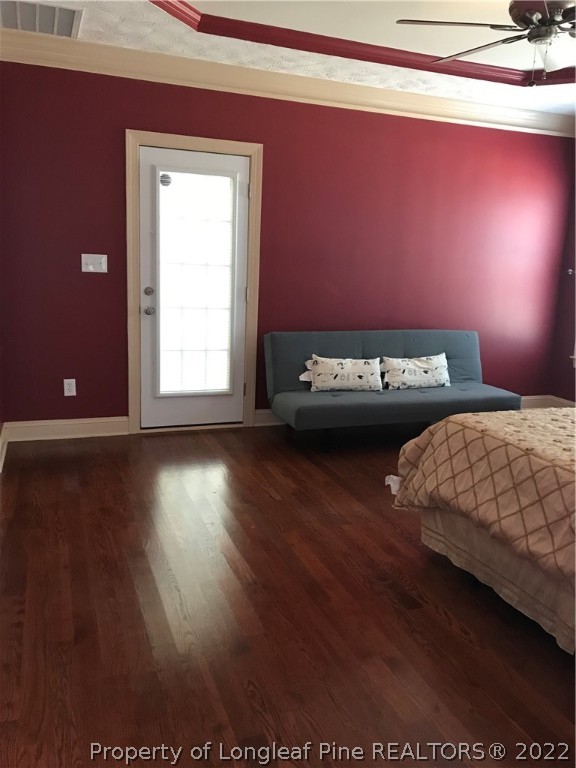 5220 Spreading Branch Road Hope Mills, NC 28348 - Photo 12 of 17 a view of bedroom with furniture and wooden floor