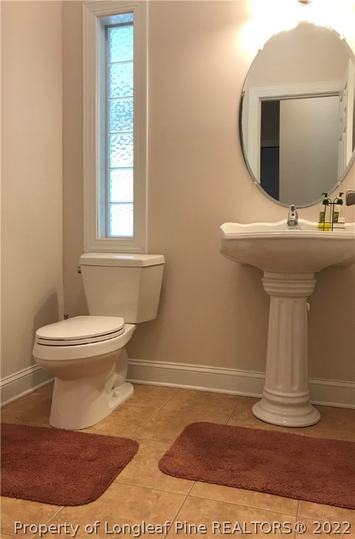 5220 Spreading Branch Road Hope Mills, NC 28348 - Photo 15 of 17 a bathroom with a toilet and a sink