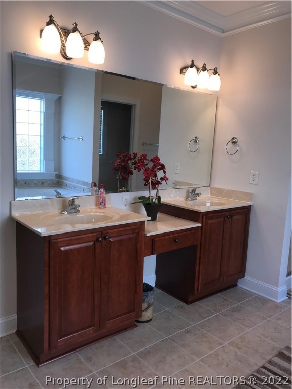 5220 Spreading Branch Road Hope Mills, NC 28348 - Photo 16 of 17 a bathroom with a sink vanity and mirror