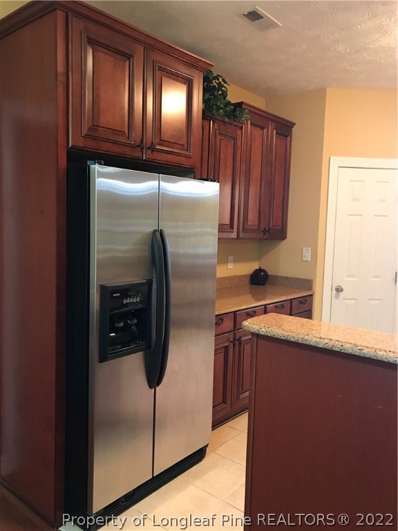 5220 Spreading Branch Road Hope Mills, NC 28348 - Photo 3 of 17 a kitchen with refrigerator and window