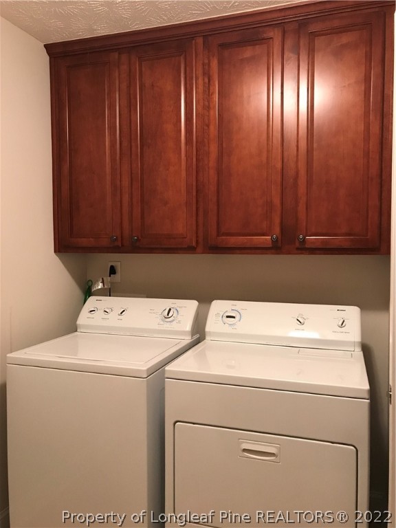 5220 Spreading Branch Road Hope Mills, NC 28348 - Photo 4 of 17 a utility room with dryer and washer