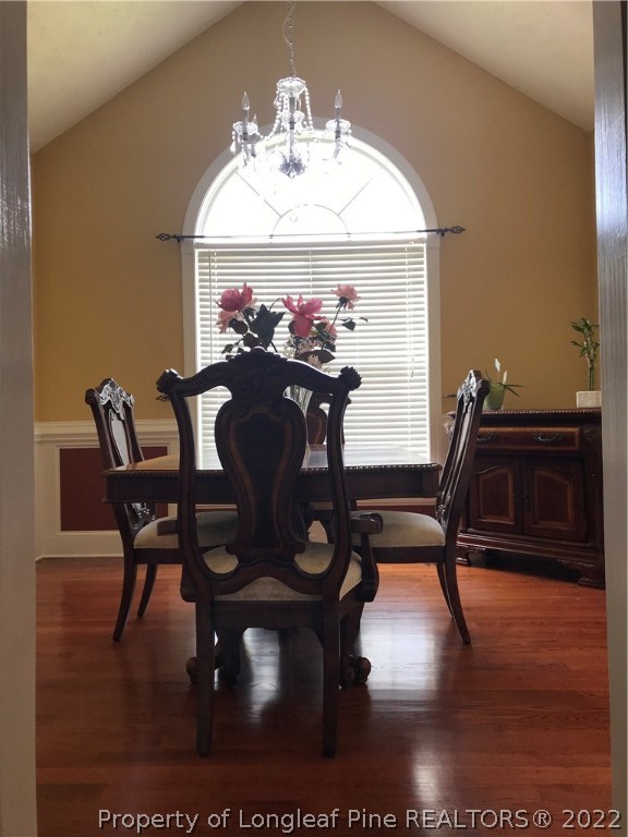 5220 Spreading Branch Road Hope Mills, NC 28348 - Photo 9 of 17 a view of a dining room with furniture and wooden floor