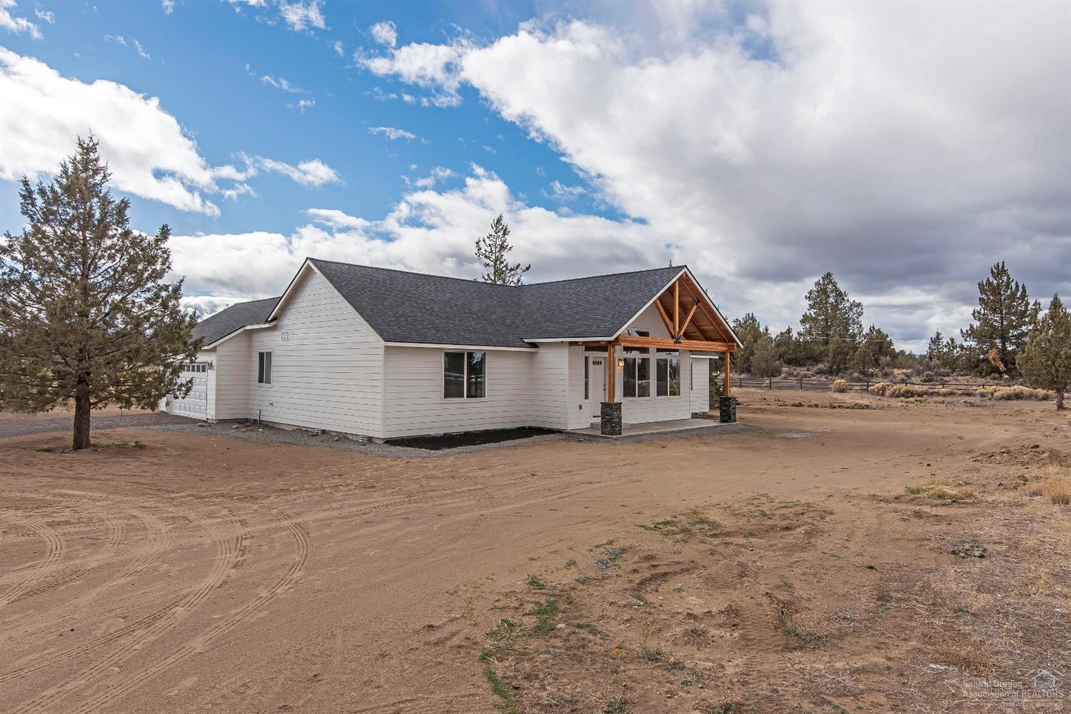 61165 Ward Road Bend, OR 97702 - Photo 25 of 25 a house with trees in front of it