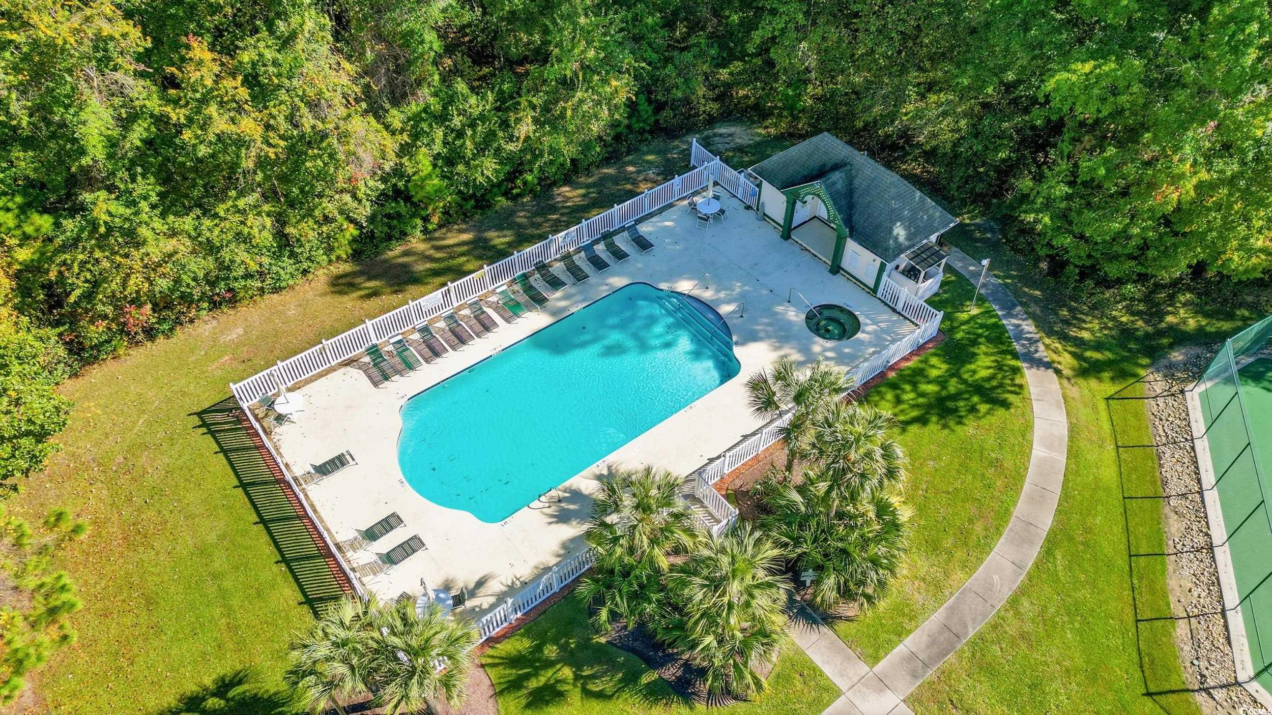 615 Tupelo Lane, Unit F Longs, SC 29568 - Photo 23 of 27 Drone / aerial view of a pool area