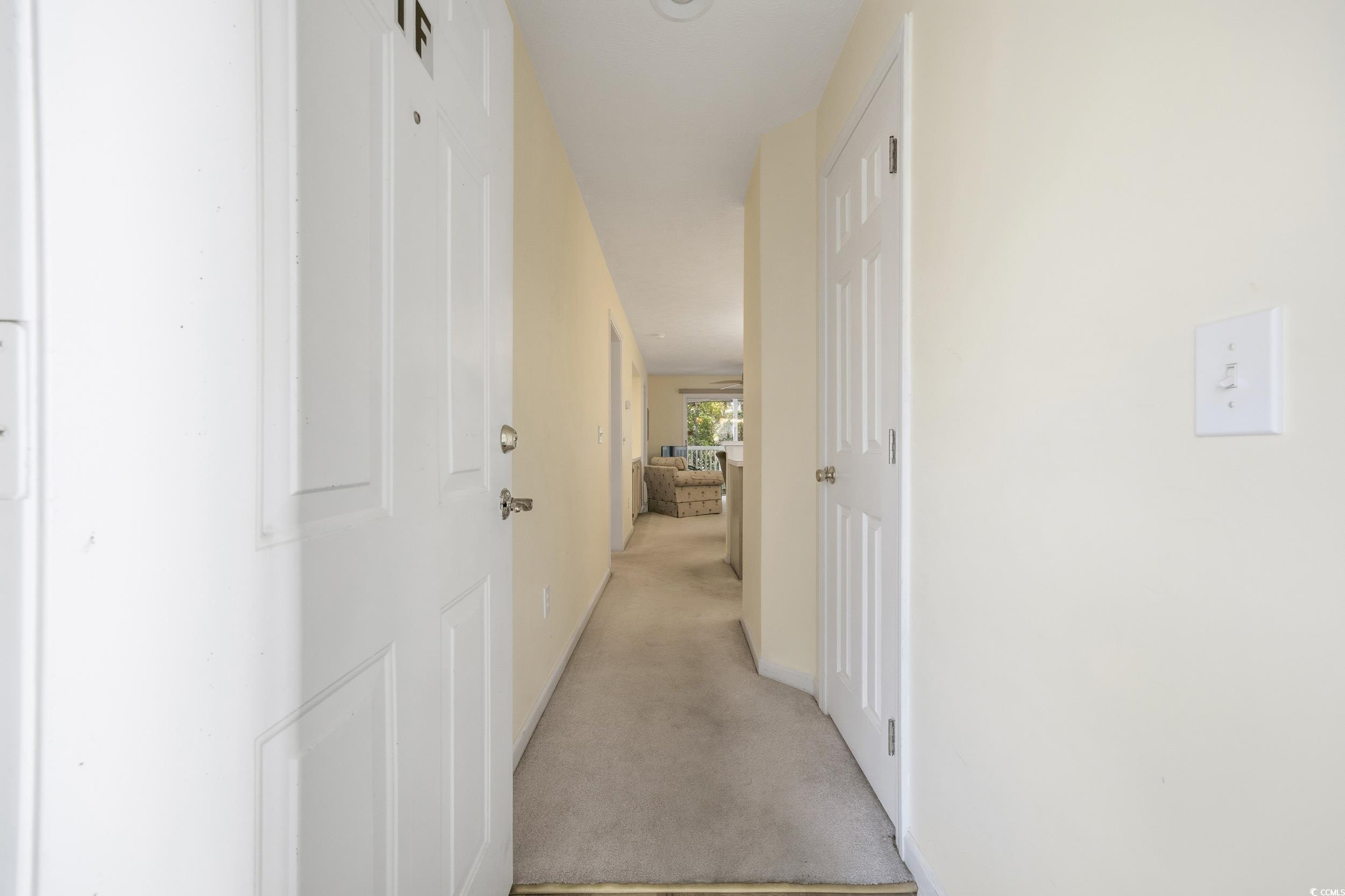 615 Tupelo Lane, Unit F Longs, SC 29568 - Photo 3 of 27 Corridor featuring carpet flooring and baseboards
