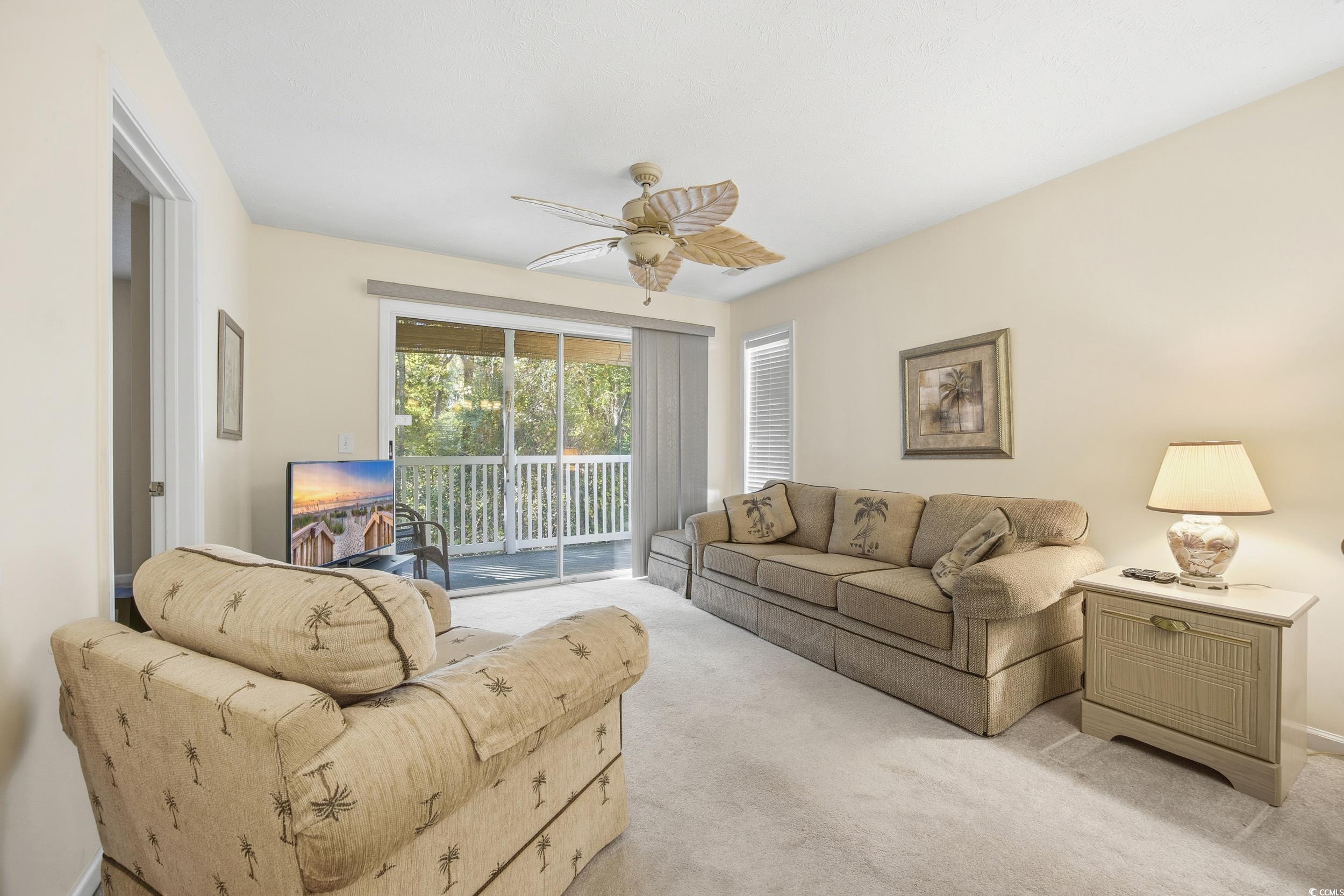 615 Tupelo Lane, Unit F Longs, SC 29568 - Photo 8 of 27 Living room with carpet flooring and a ceiling fan