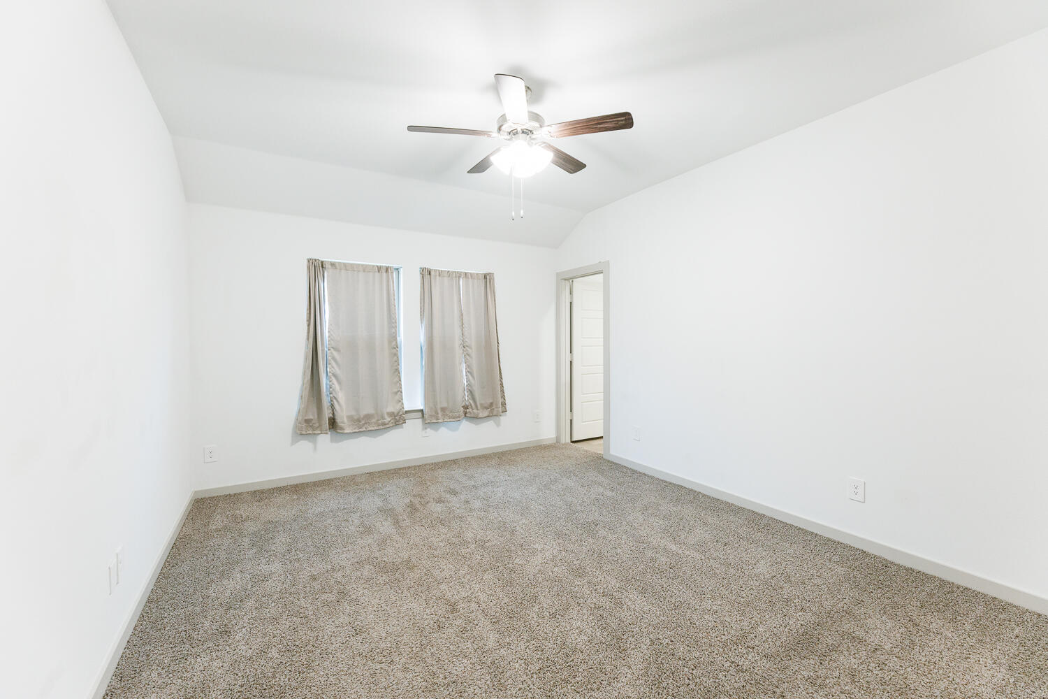 2305 150th Street Lubbock, TX 79423 - Photo 19 of 39 an empty room with fan and windows