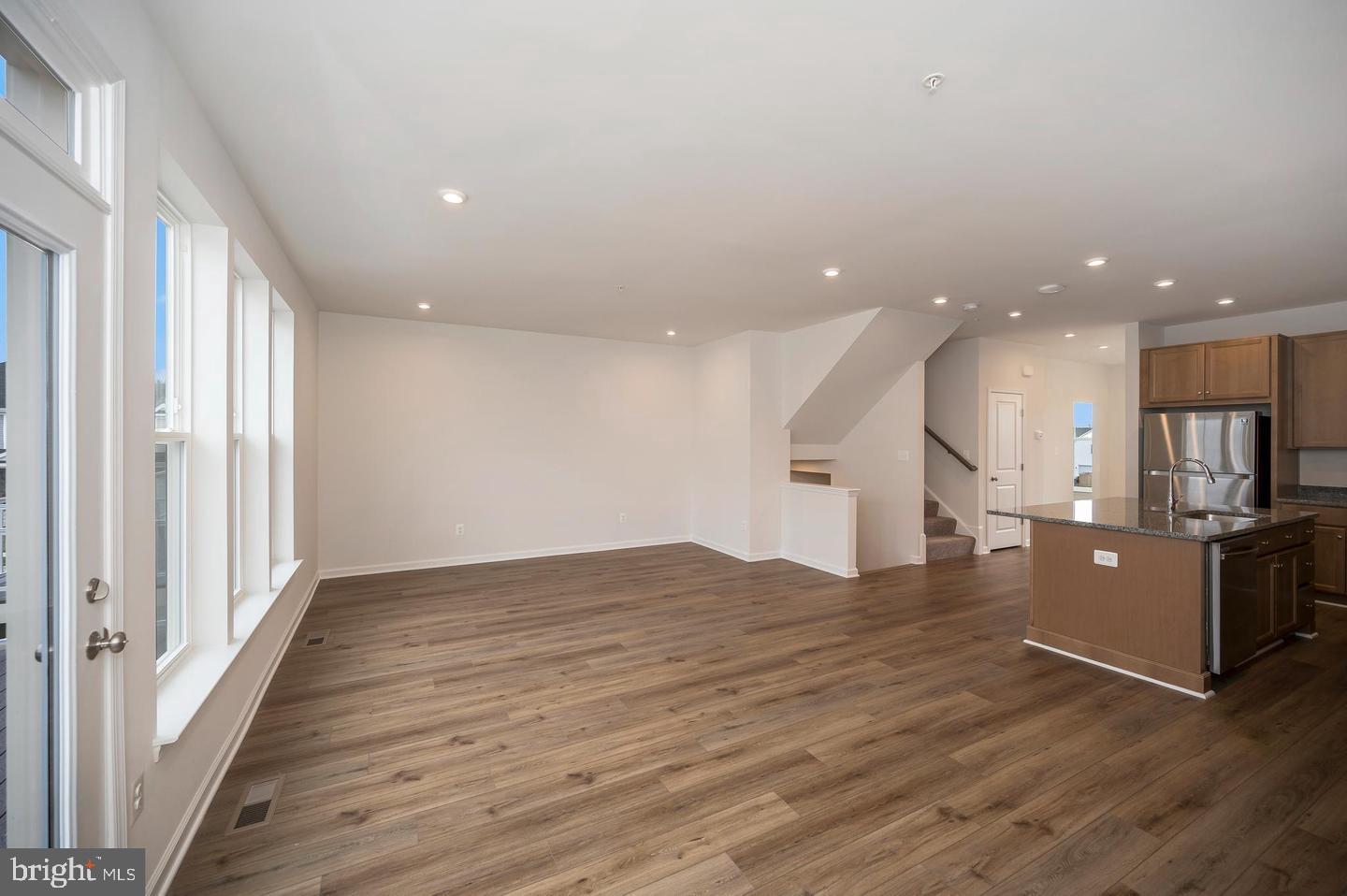 360 Coastal Avenue, Unit 102 Stafford, VA 22554 - Photo 11 of 25 a view of kitchen with cabinets and wooden floor