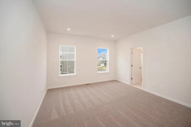 a bathroom with a double vanity sink and mirror