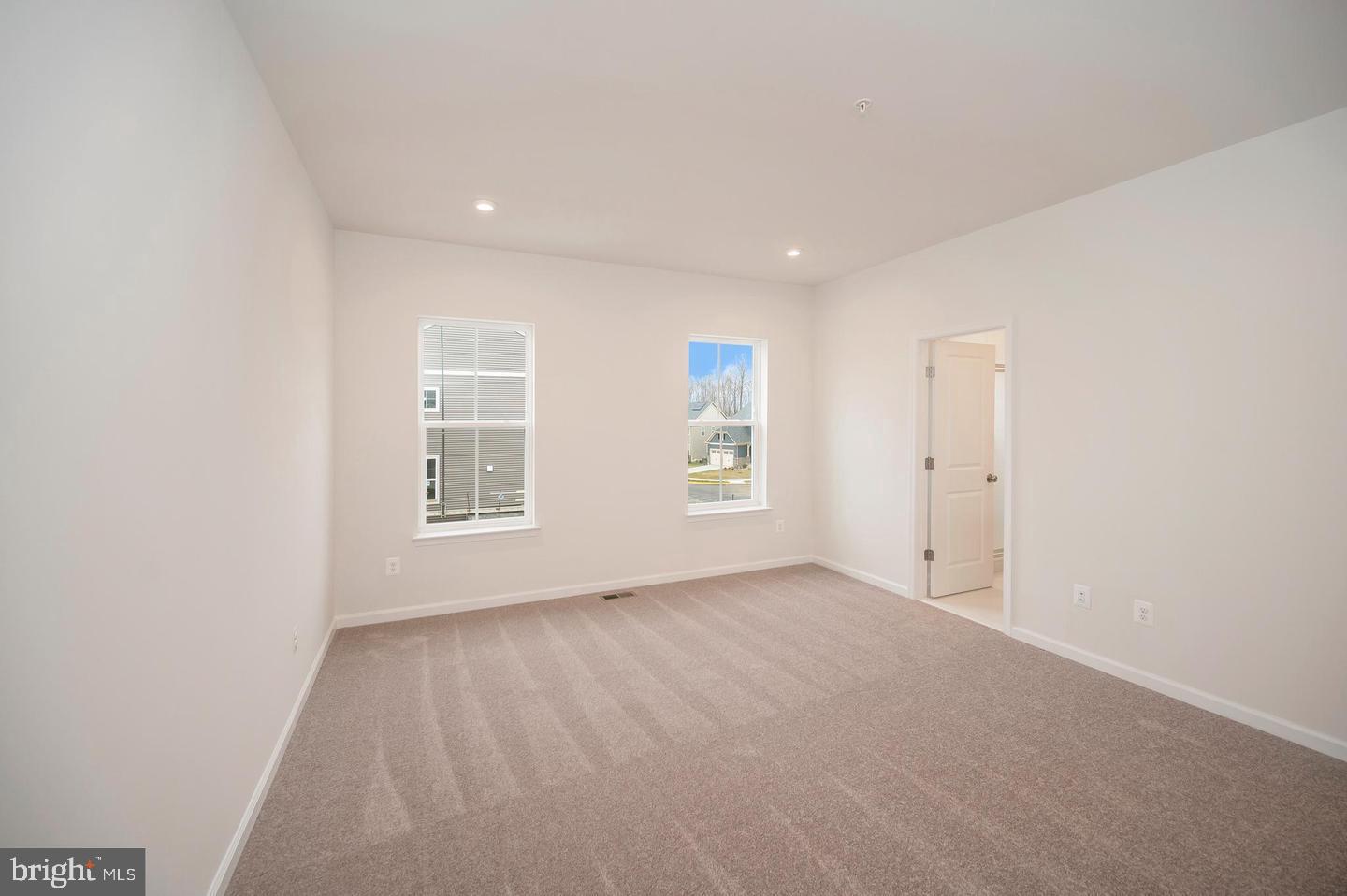 360 Coastal Avenue, Unit 102 Stafford, VA 22554 - Photo 14 of 25 an empty room with windows