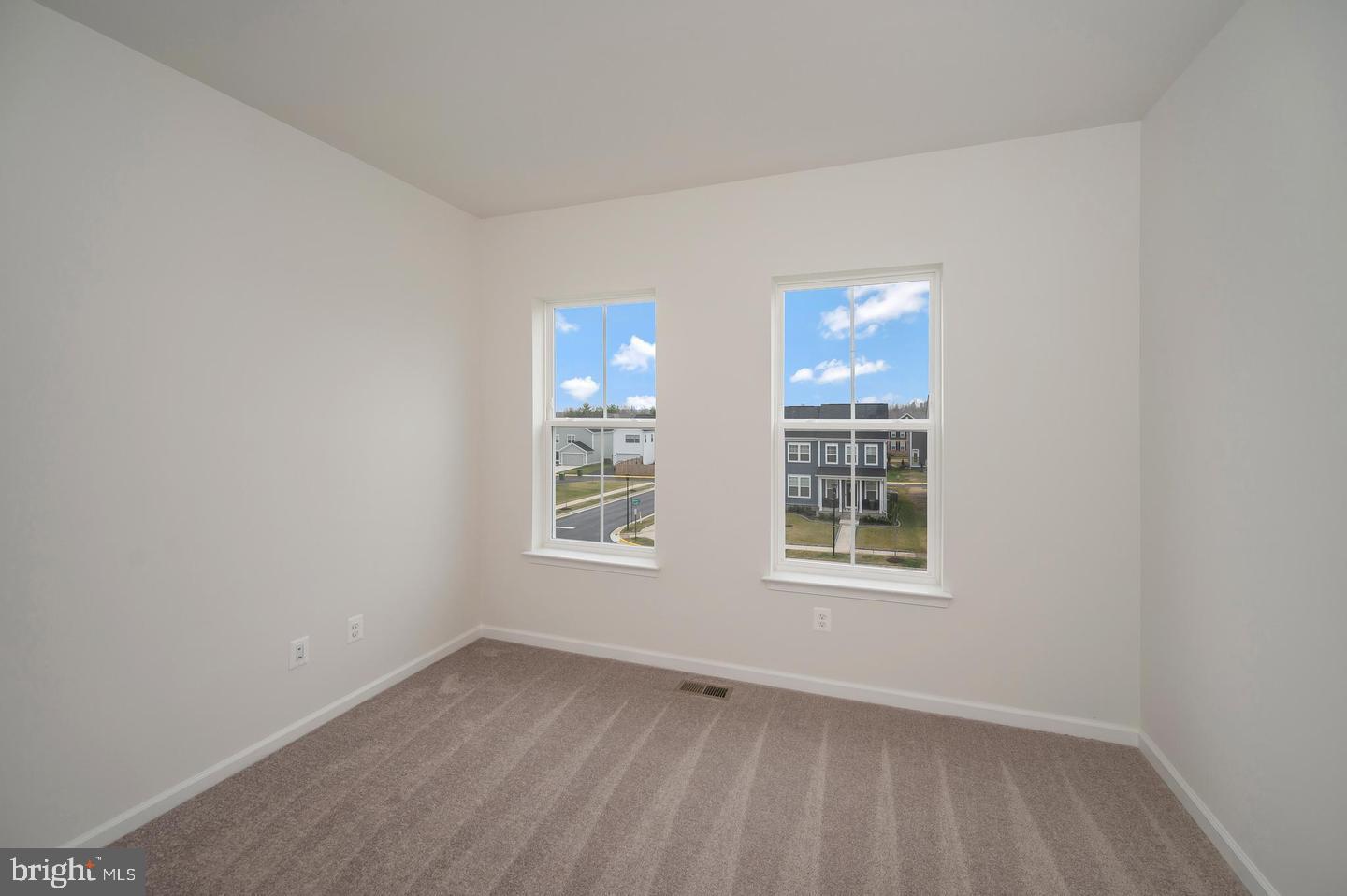 360 Coastal Avenue, Unit 102 Stafford, VA 22554 - Photo 15 of 25 an empty room with a window