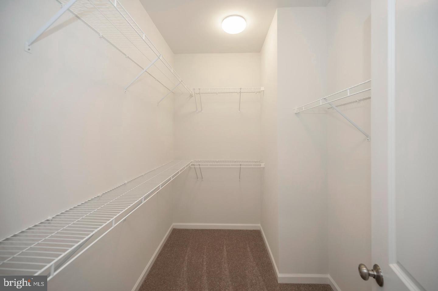 360 Coastal Avenue, Unit 102 Stafford, VA 22554 - Photo 18 of 25 a view of a room with white door