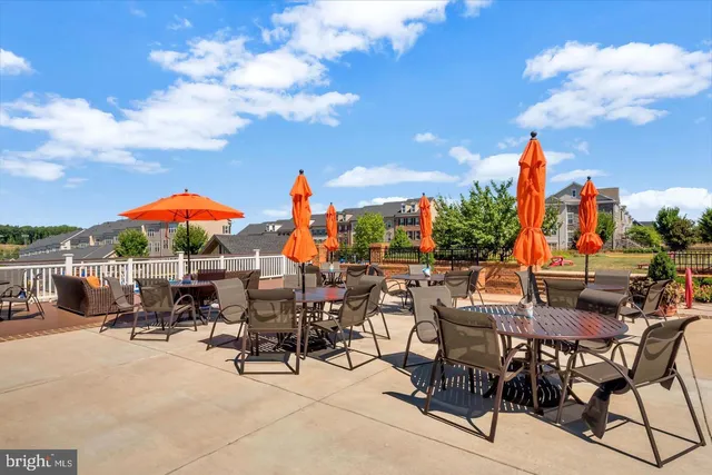 a view of a house with a big yard and large trees