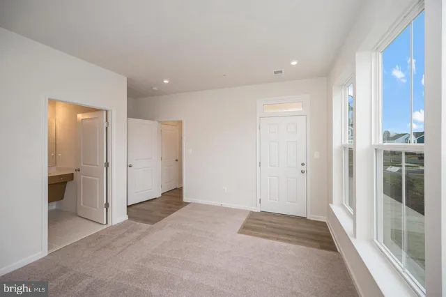 a view of entryway with wooden floor
