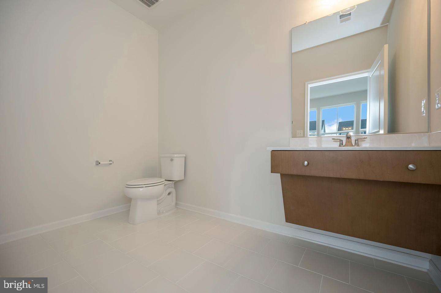 360 Coastal Avenue, Unit 102 Stafford, VA 22554 - Photo 5 of 25 a bathroom with a toilet