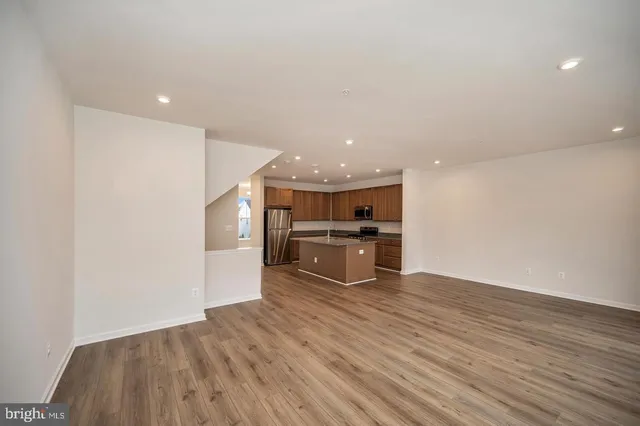 a view of kitchen with cabinets and wooden floor
