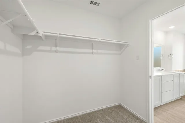 a view of an empty walk in closet