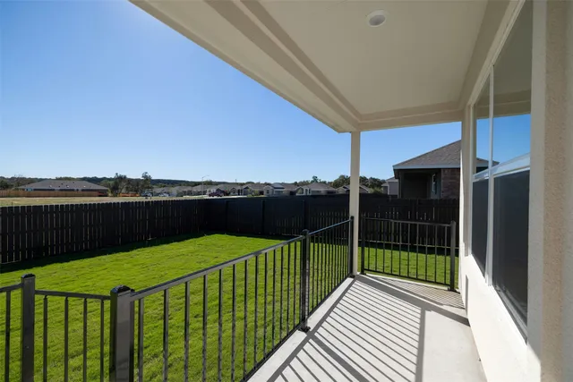a view of a balcony with an ocean view