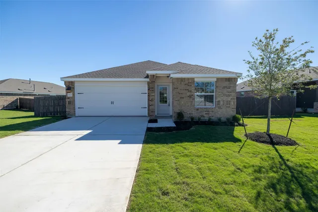 a view of backyard with a garden and entertaining space