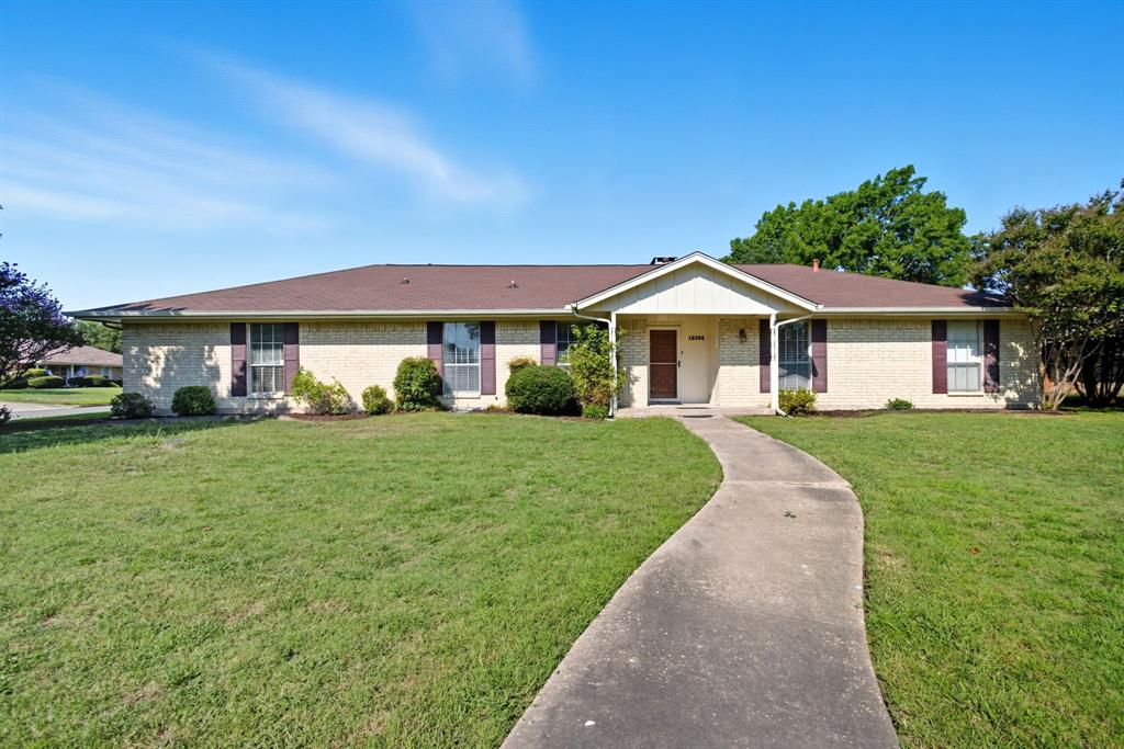 10304 Oak Creek Drive Greenville, TX 75402 - Photo 1 of 25 a front view of a house with a yard