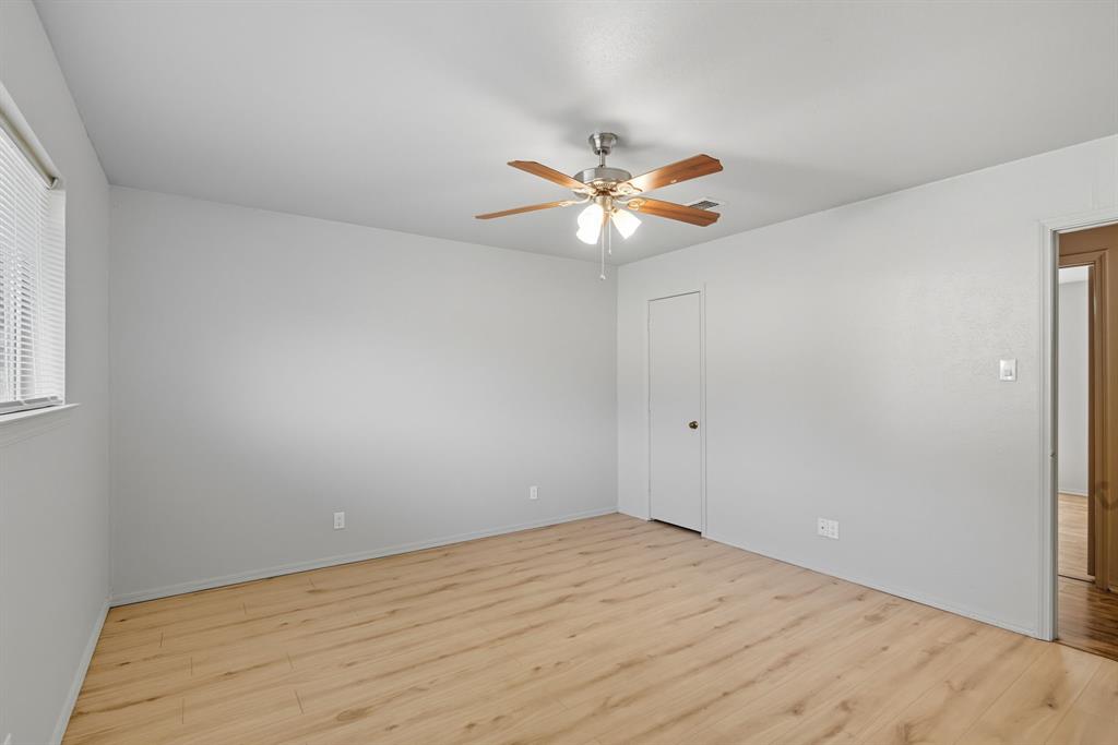 10304 Oak Creek Drive Greenville, TX 75402 - Photo 18 of 25 a view of an empty room with a window
