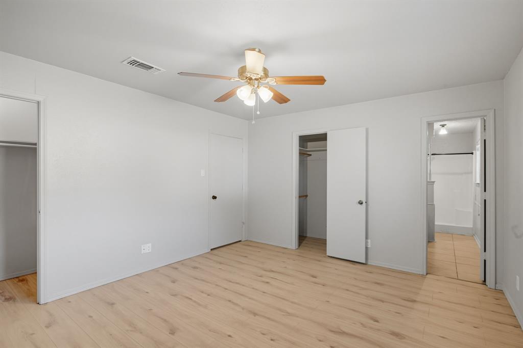 10304 Oak Creek Drive Greenville, TX 75402 - Photo 19 of 25 a view of an empty room and chandelier fan