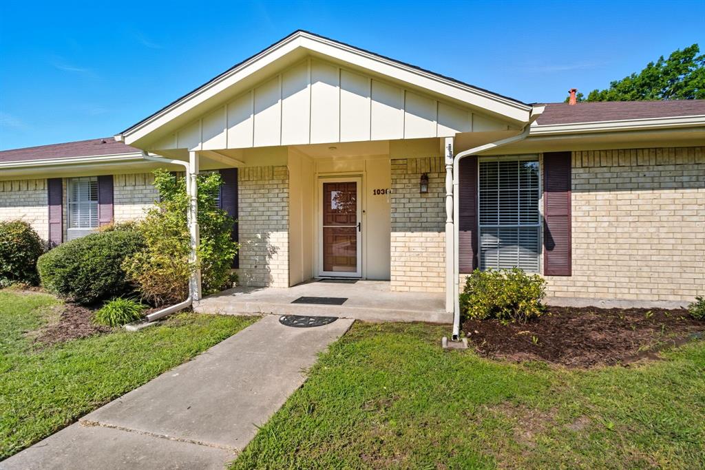10304 Oak Creek Drive Greenville, TX 75402 - Photo 2 of 25 a front view of a house with a yard