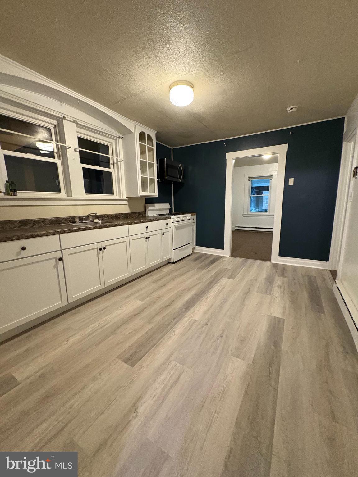 353 Rock Springs Road Conowingo, MD 21918 - Photo 13 of 16 a large bedroom with a large bed and a large window