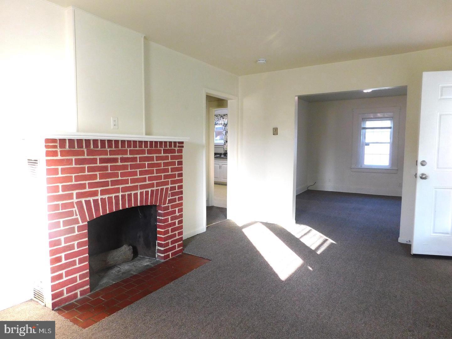 353 Rock Springs Road Conowingo, MD 21918 - Photo 7 of 16 a view of empty room with fireplace