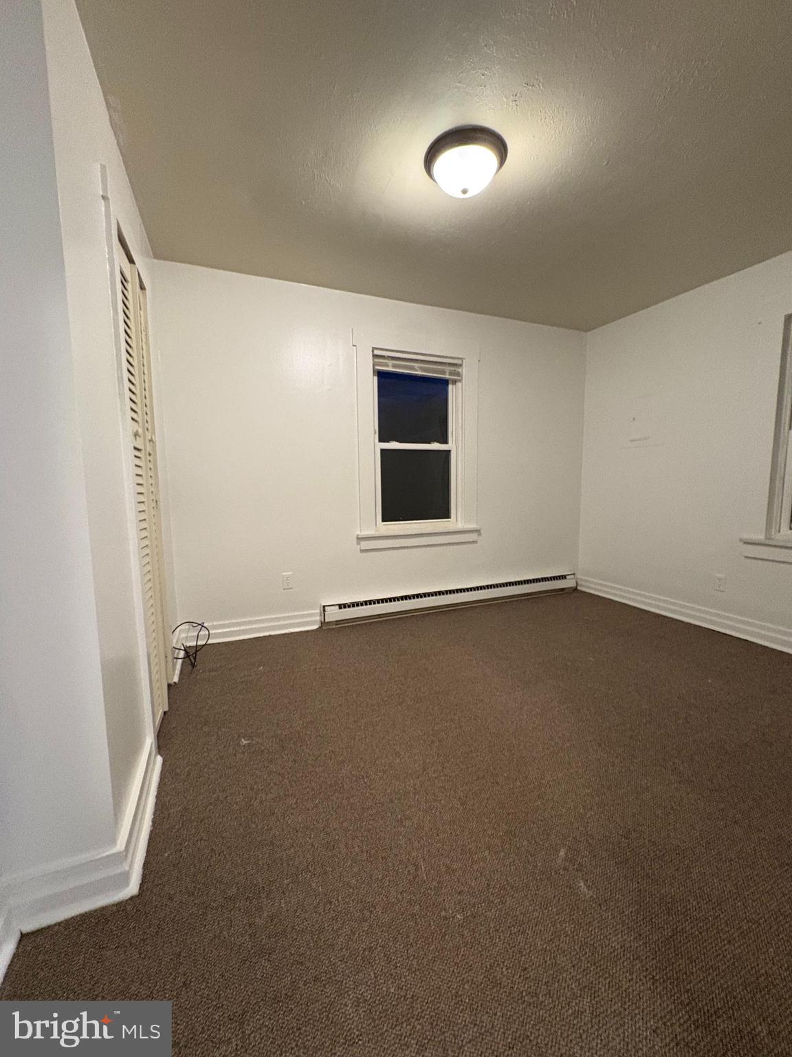 353 Rock Springs Road Conowingo, MD 21918 - Photo 9 of 16 an empty room with a empty space and windows