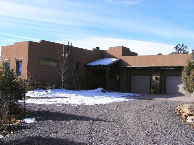 a view of house with yard