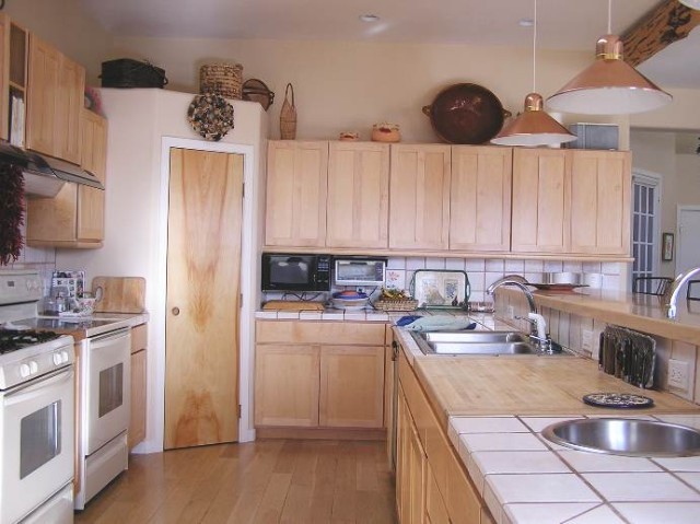 50 Ridgeview Lane Ridgway, CO 81432 - Photo 3 of 6 a kitchen with a sink a stove and cabinets