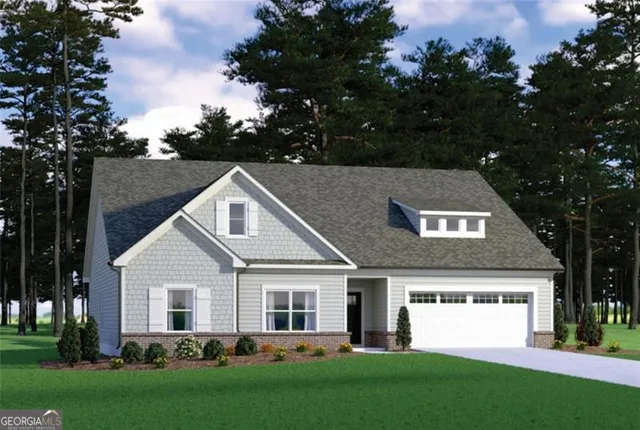 a front view of house with yard and green space