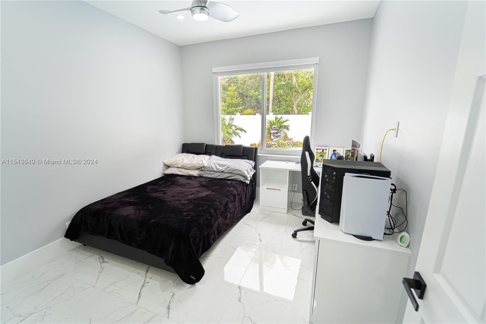 10159 Umberland Place Boca Raton, FL 33428 - Photo 17 of 25 a bedroom with a bed and a table