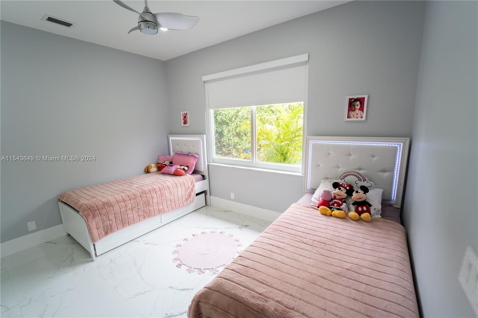 10159 Umberland Place Boca Raton, FL 33428 - Photo 19 of 25 a bedroom with a bed and a window