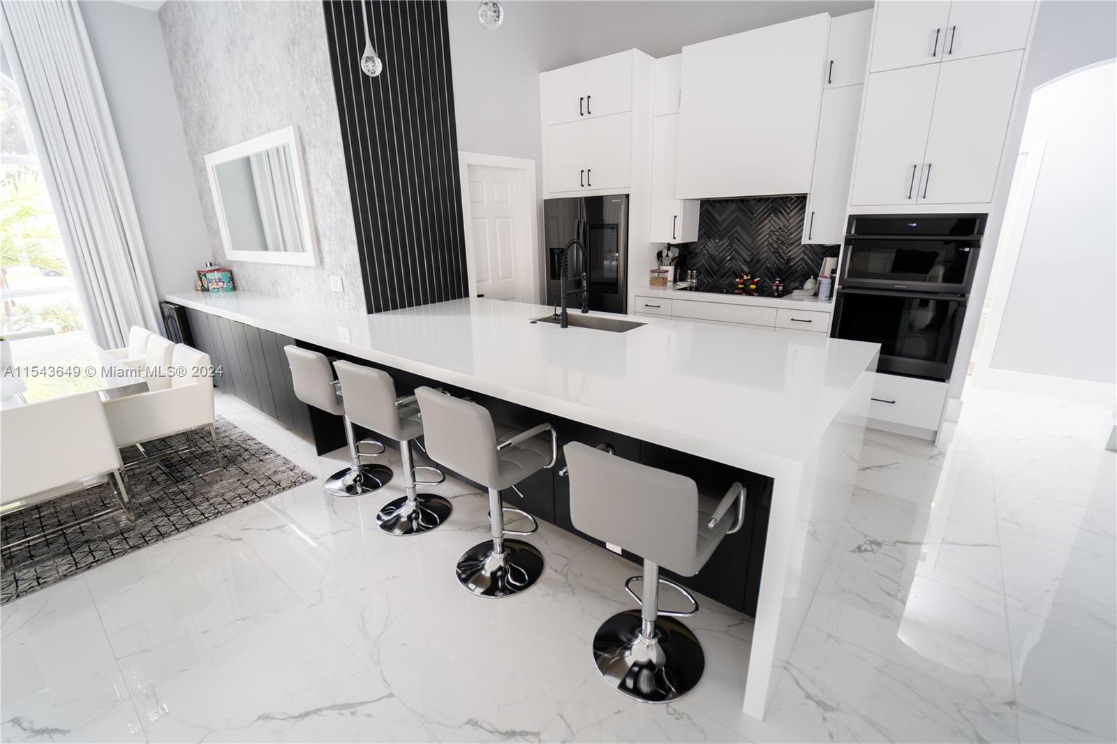 10159 Umberland Place Boca Raton, FL 33428 - Photo 7 of 25 a kitchen with a sink appliances and cabinets