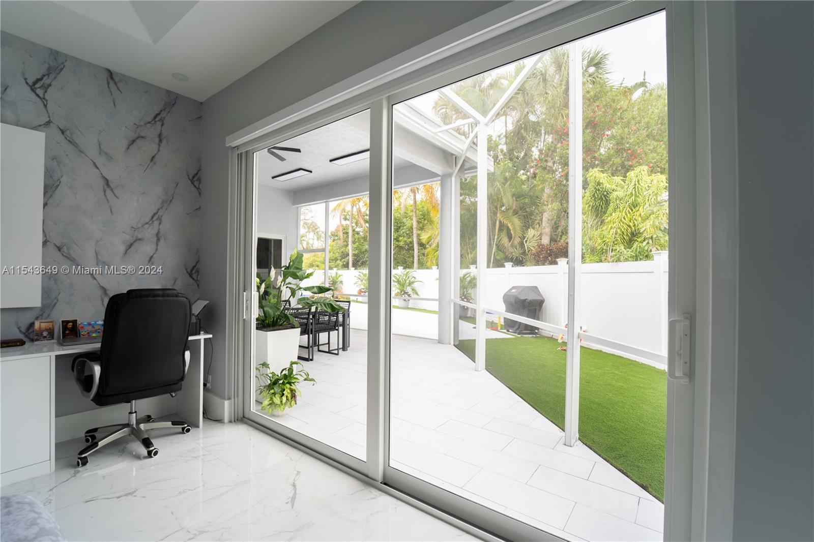 10159 Umberland Place Boca Raton, FL 33428 - Photo 9 of 25 a view of a room with chair and front door