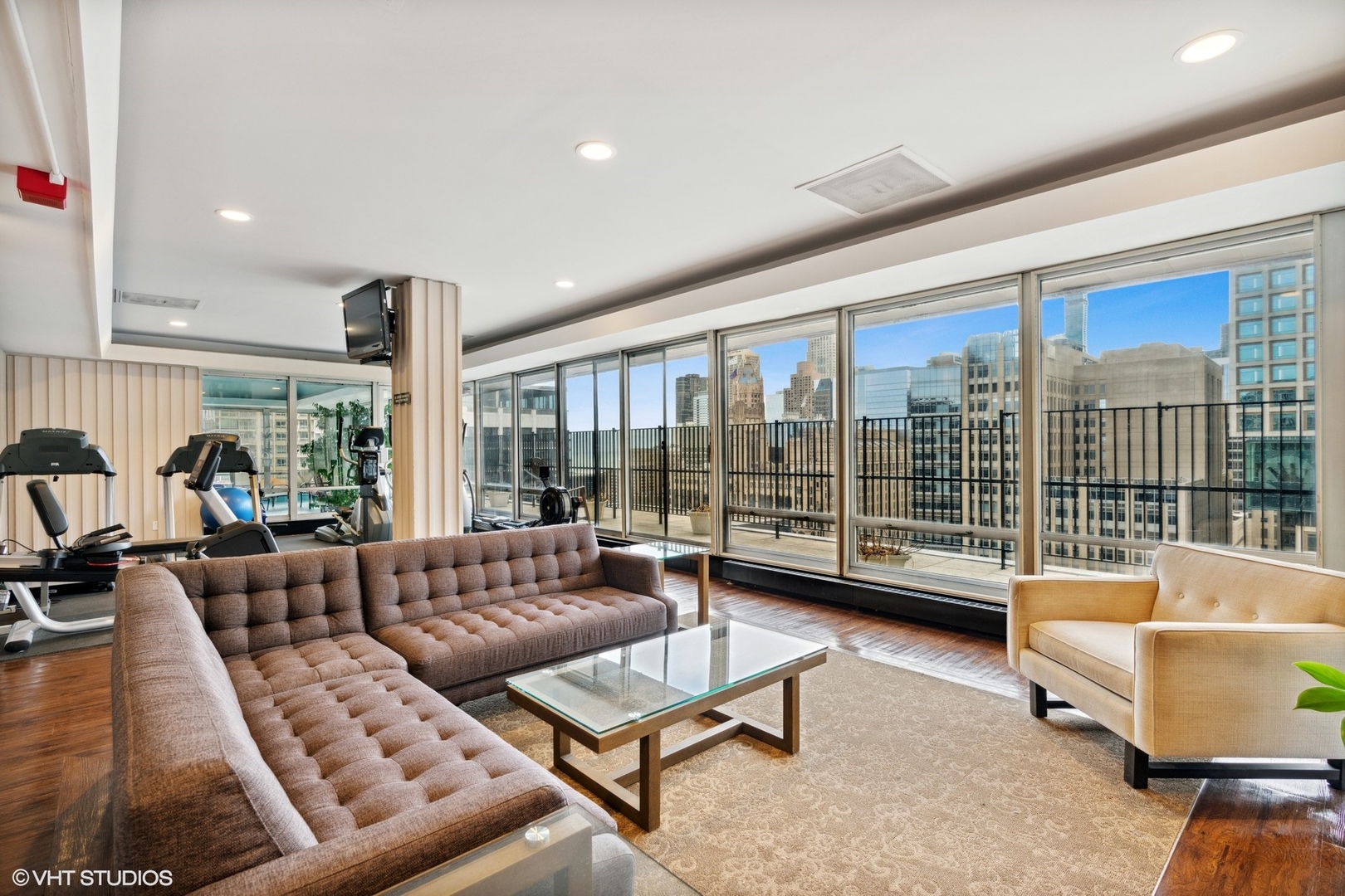 201 East Chestnut Street, Unit 10E Chicago, IL 60611 - Photo 12 of 12 a living room with furniture and a large window