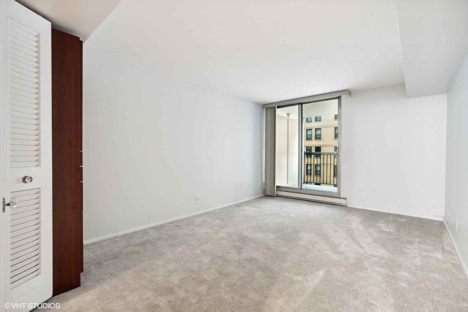 201 East Chestnut Street, Unit 10E Chicago, IL 60611 - Photo 5 of 12 an empty room with windows