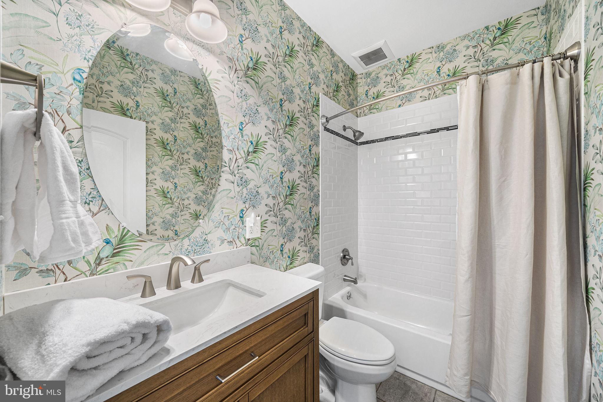 1232 Shenandoah Road Alexandria, VA 22308 - Photo 11 of 50 a bathroom with a granite countertop sink and a mirror