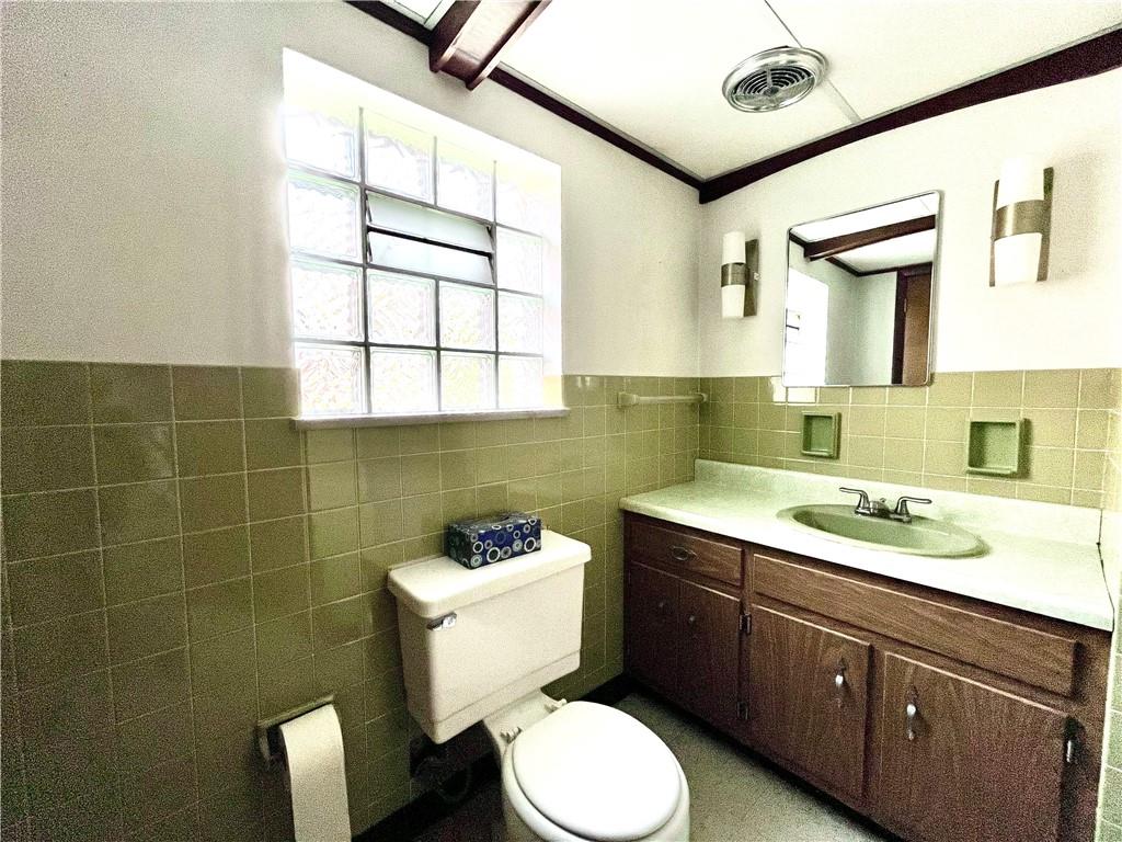 1291 Marcia Drive Irwin, PA 15642 - Photo 19 of 32 a bathroom with a granite countertop toilet sink and mirror