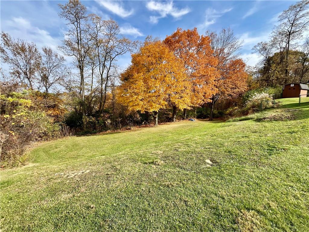 1291 Marcia Drive Irwin, PA 15642 - Photo 29 of 32 a view of outdoor space with trees all around