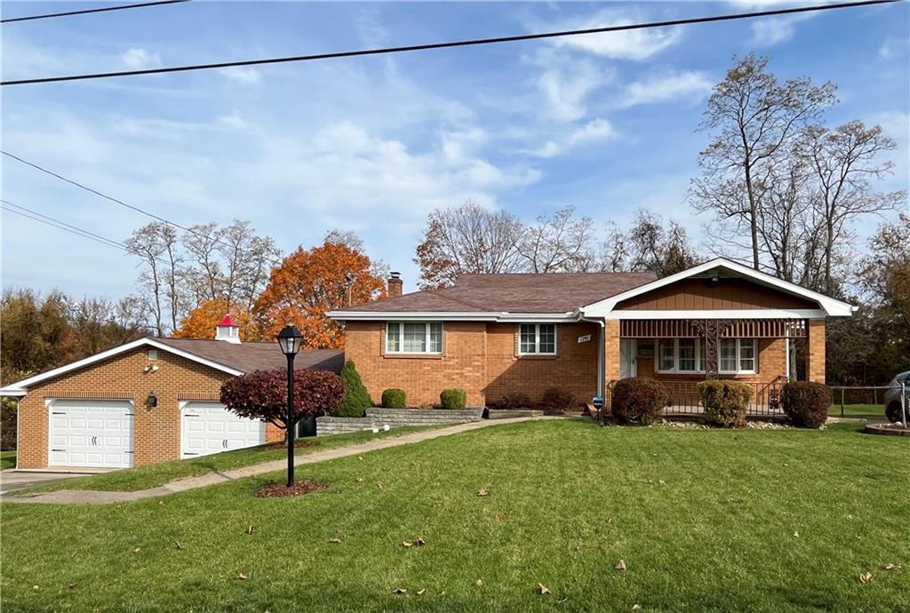 1291 Marcia Drive Irwin, PA 15642 - Photo 32 of 32 a front view of a house with a garden
